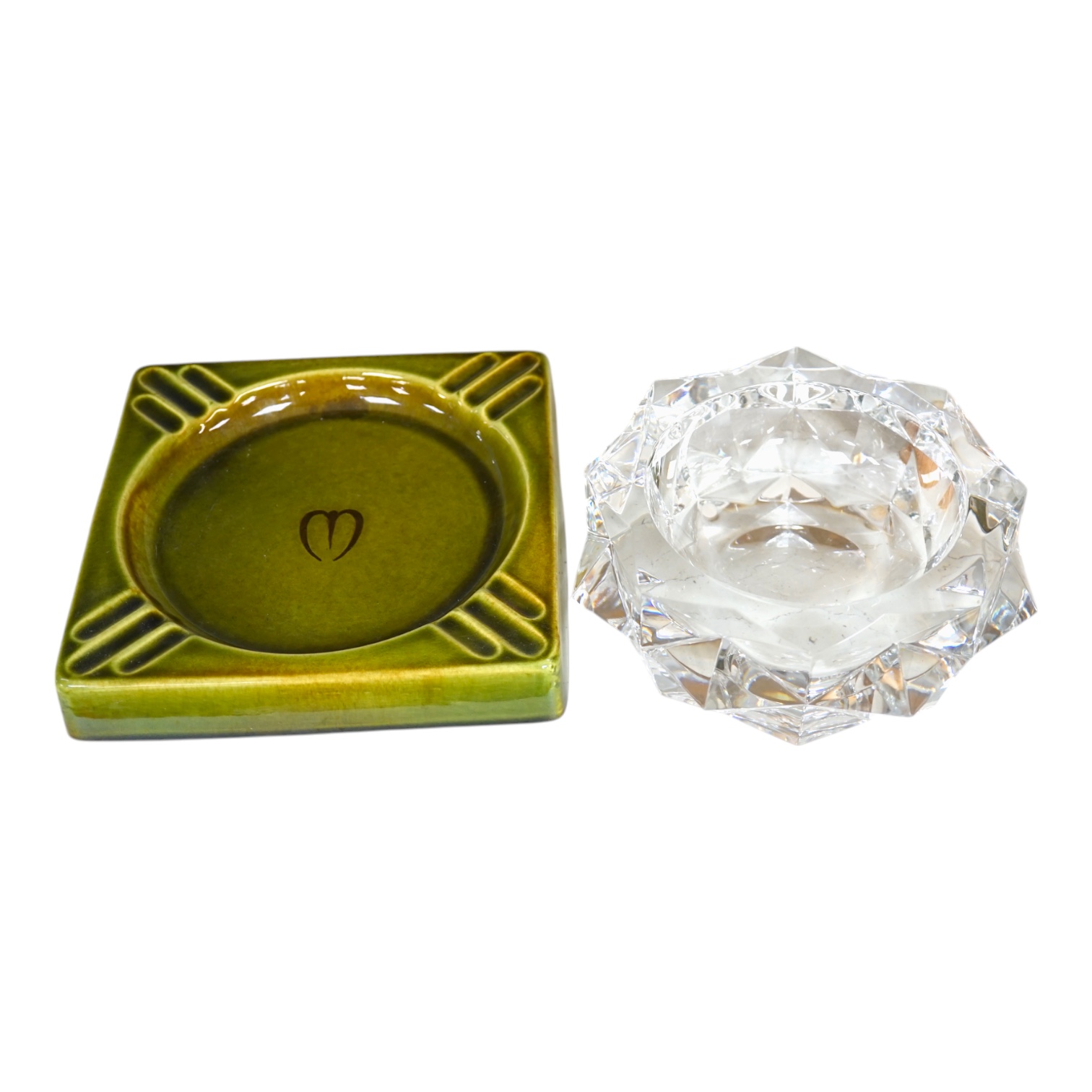 A Baccarat ashtray, 19cm diameter, and a Gefle Swedish ashtray, 20cm wide. Condition - good.